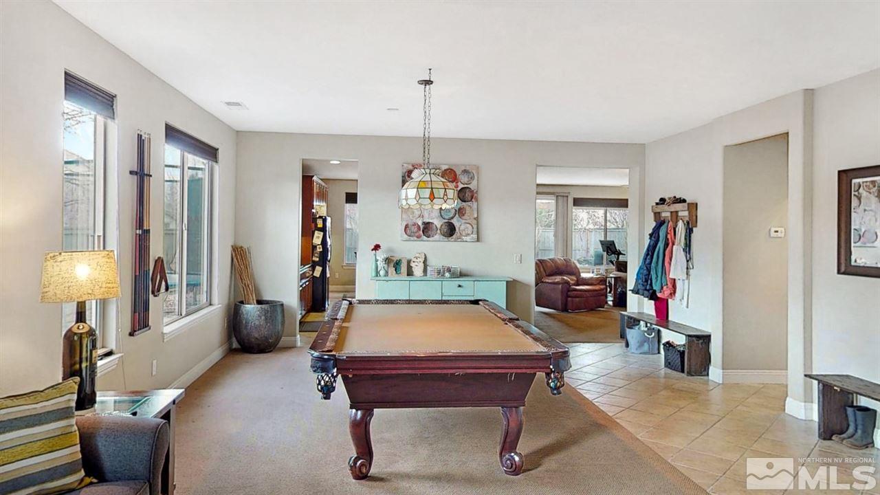 14095 Winners Cup Drive Reno, NV 89521 - Photo 3 of 23 a room with furniture and a chandelier