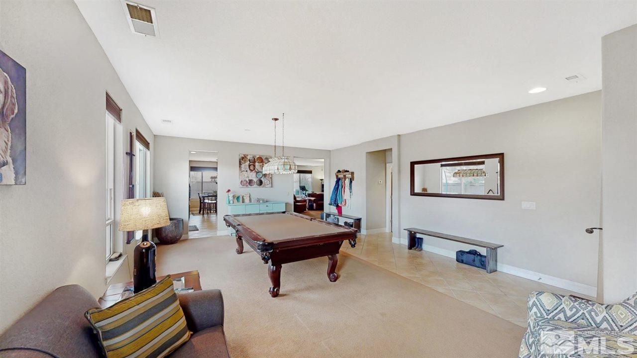 14095 Winners Cup Drive Reno, NV 89521 - Photo 4 of 23 a living room with furniture and a couch