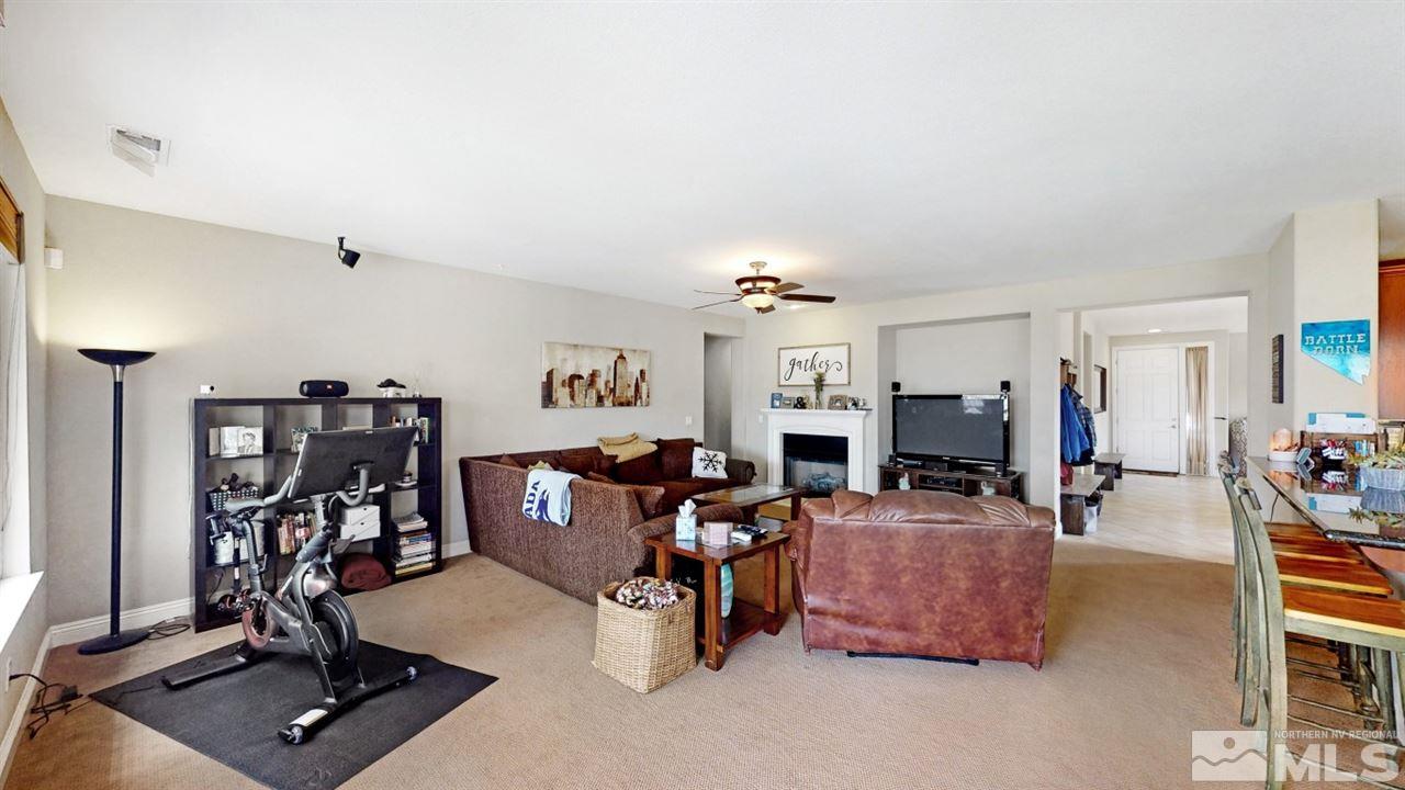 14095 Winners Cup Drive Reno, NV 89521 - Photo 8 of 23 a view of a livingroom with furniture and a flat screen tv