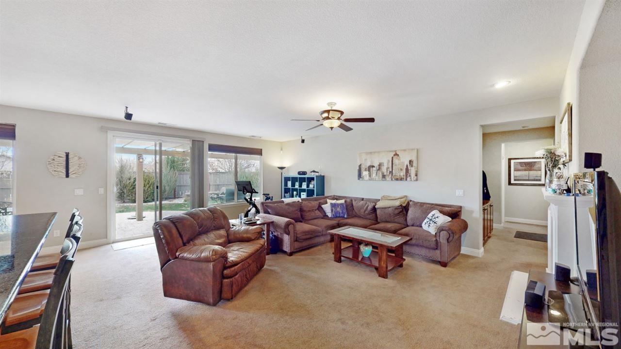 14095 Winners Cup Drive Reno, NV 89521 - Photo 9 of 23 a living room with furniture and a flat screen tv