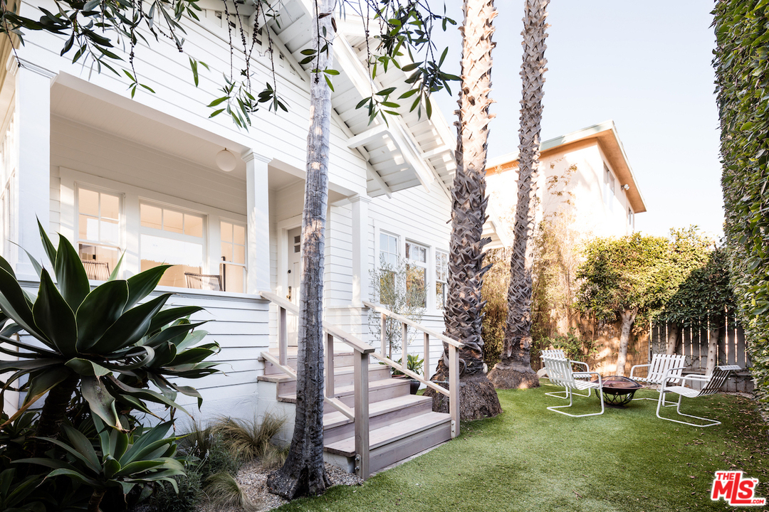 325 Brooks Avenue Venice, CA 90291 - Photo 2 of 25 a view of a house with a large tree and a yard in front of it
