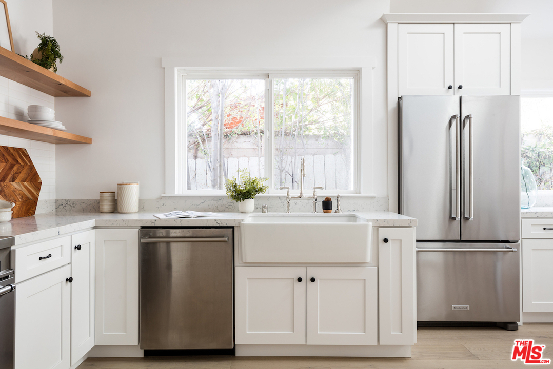 325 Brooks Avenue Venice, CA 90291 - Photo 11 of 25 a kitchen with stainless steel appliances a sink and a refrigerator