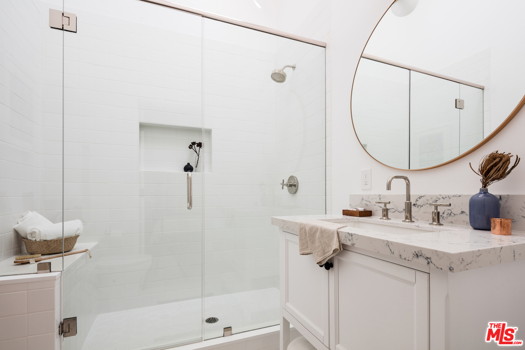 325 Brooks Avenue Venice, CA 90291 - Photo 14 of 25 a bathroom with a sink vanity tub and shower