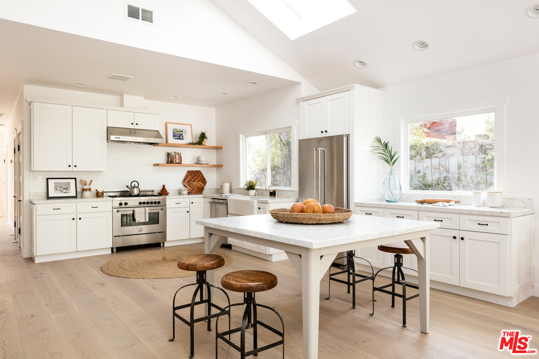 325 Brooks Avenue Venice, CA 90291 - Photo 8 of 25 a kitchen with white cabinets and appliances