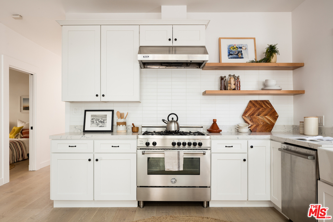325 Brooks Avenue Venice, CA 90291 - Photo 10 of 25 a kitchen with white cabinets and white appliances