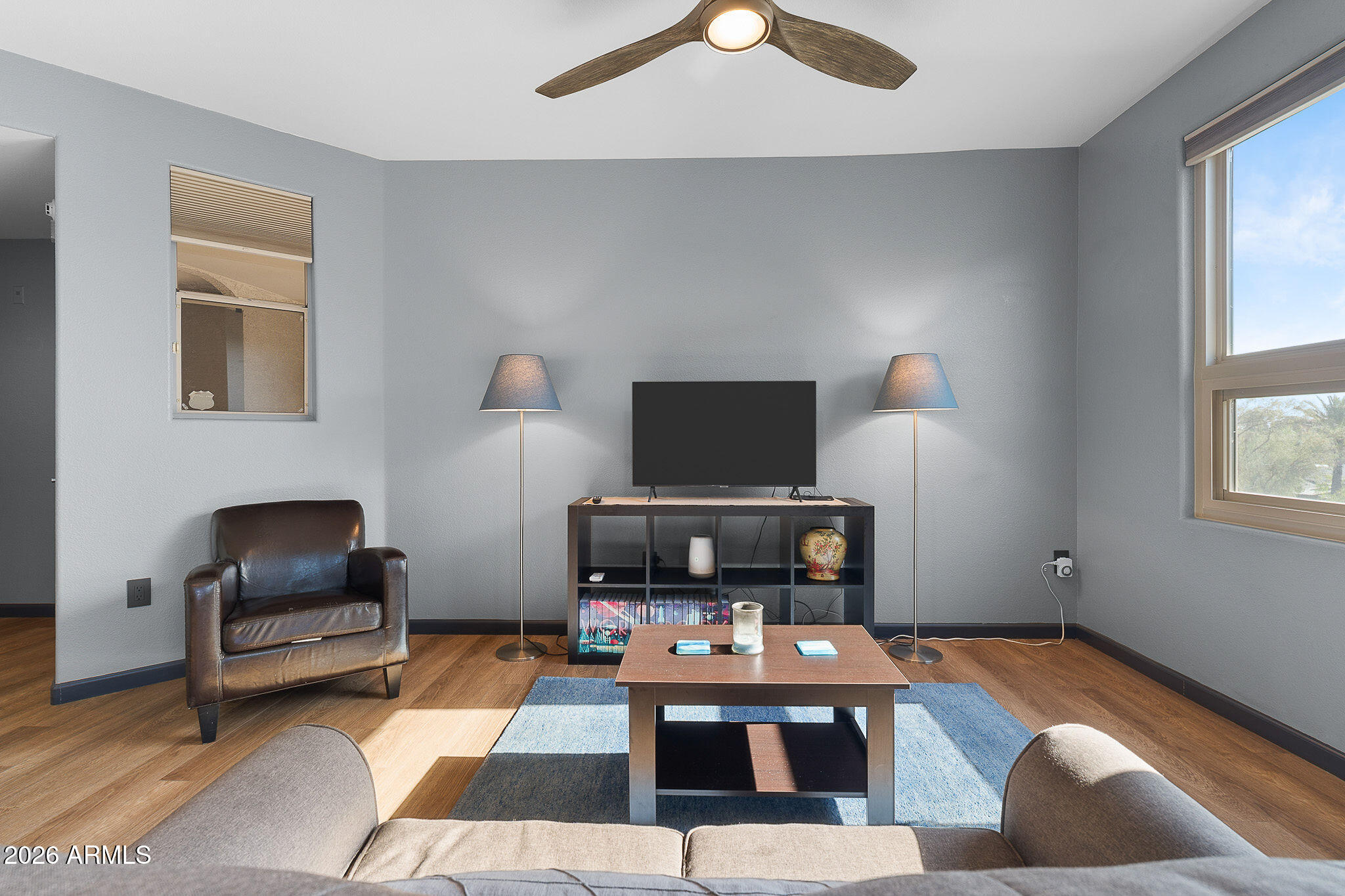 5303 North 7th Street, Unit 331 Phoenix, AZ 85014 - Photo 9 of 39 a living room with furniture and a flat screen tv