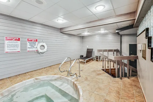 a view of a swimming pool with a lounge chairs