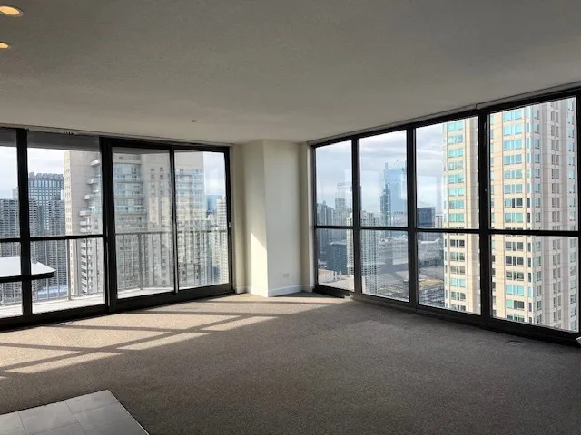 a view of an empty room with windows