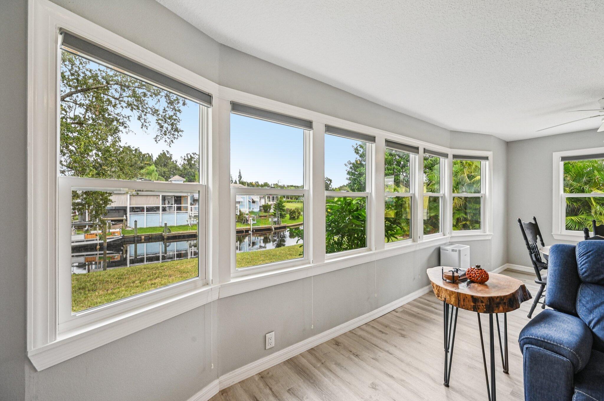 251 Southeast Paradise Place Stuart, FL 34997 - Photo 18 of 39 a dining room with furniture and windows