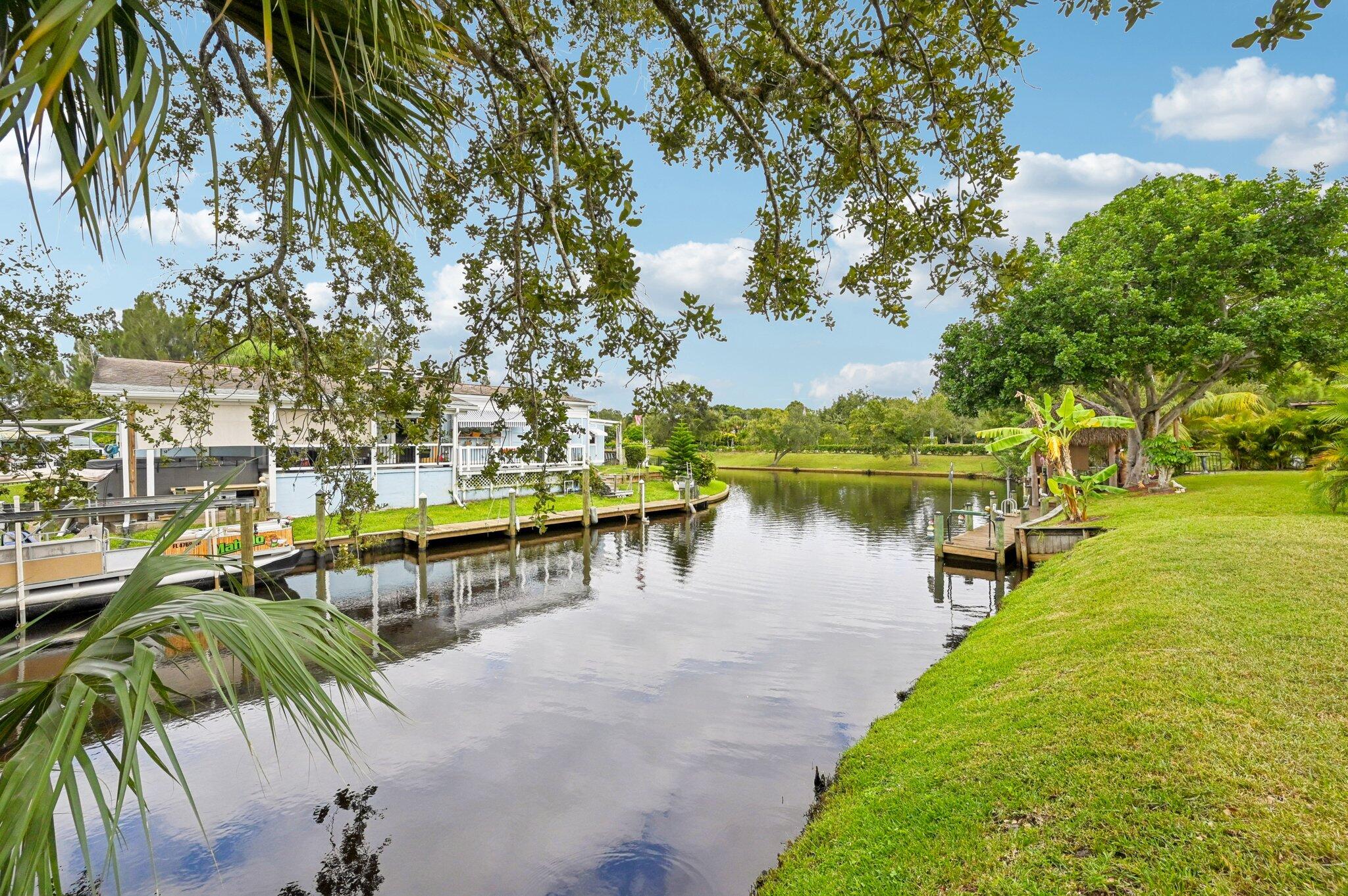 251 Southeast Paradise Place Stuart, FL 34997 - Photo 25 of 39 a view of a lake with houses