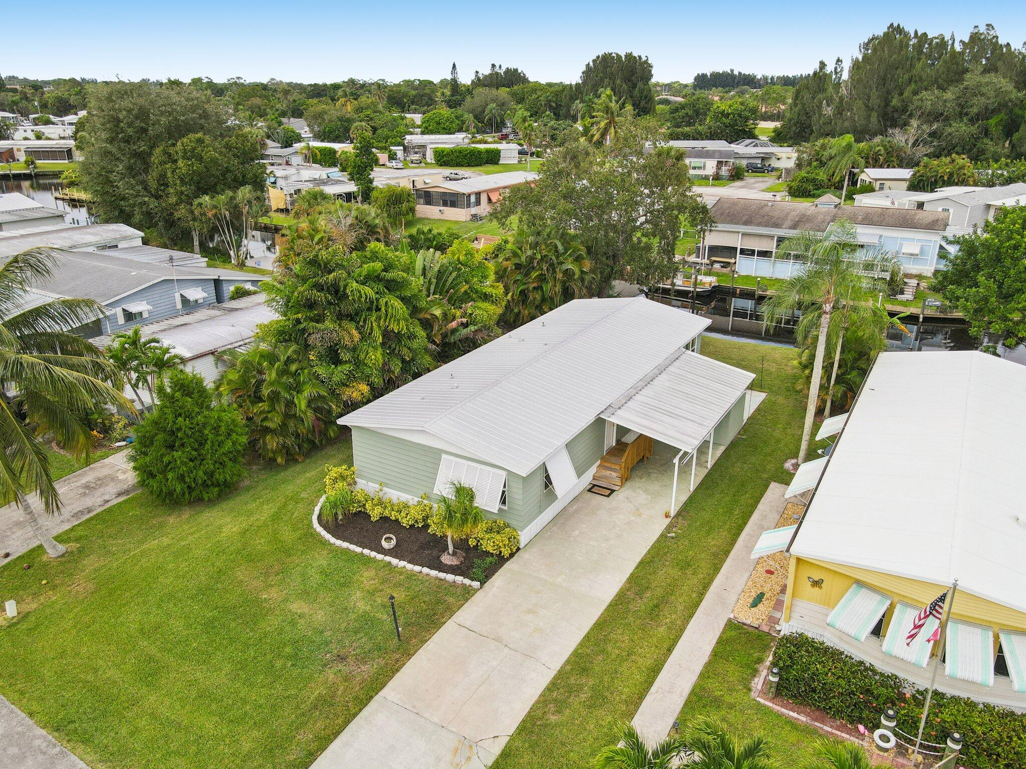 251 Southeast Paradise Place Stuart, FL 34997 - Photo 27 of 39 an aerial view of a house with a yard