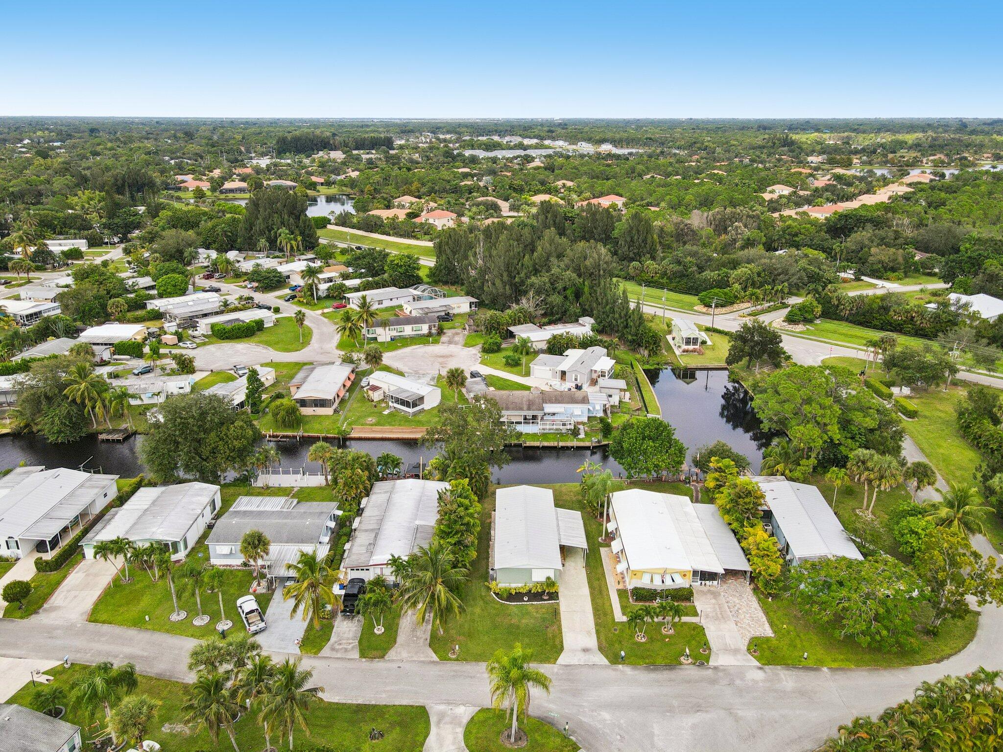 251 Southeast Paradise Place Stuart, FL 34997 - Photo 29 of 39 an aerial view of residential houses with outdoor space
