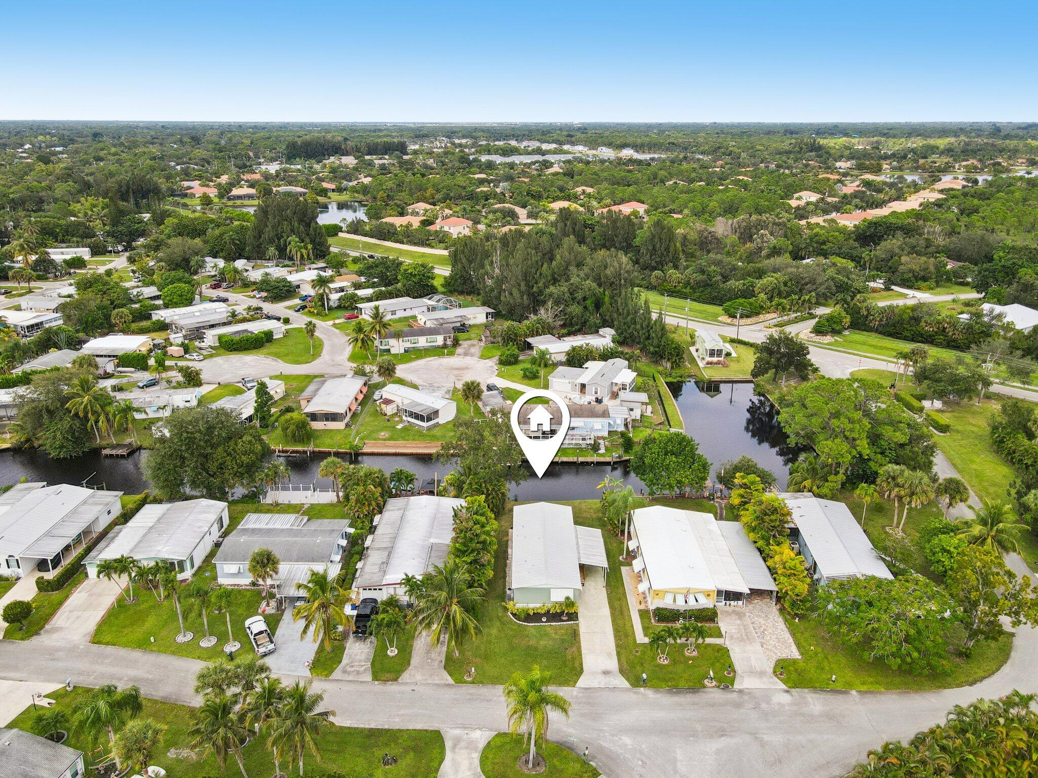 251 Southeast Paradise Place Stuart, FL 34997 - Photo 30 of 39 an aerial view of residential houses with outdoor space