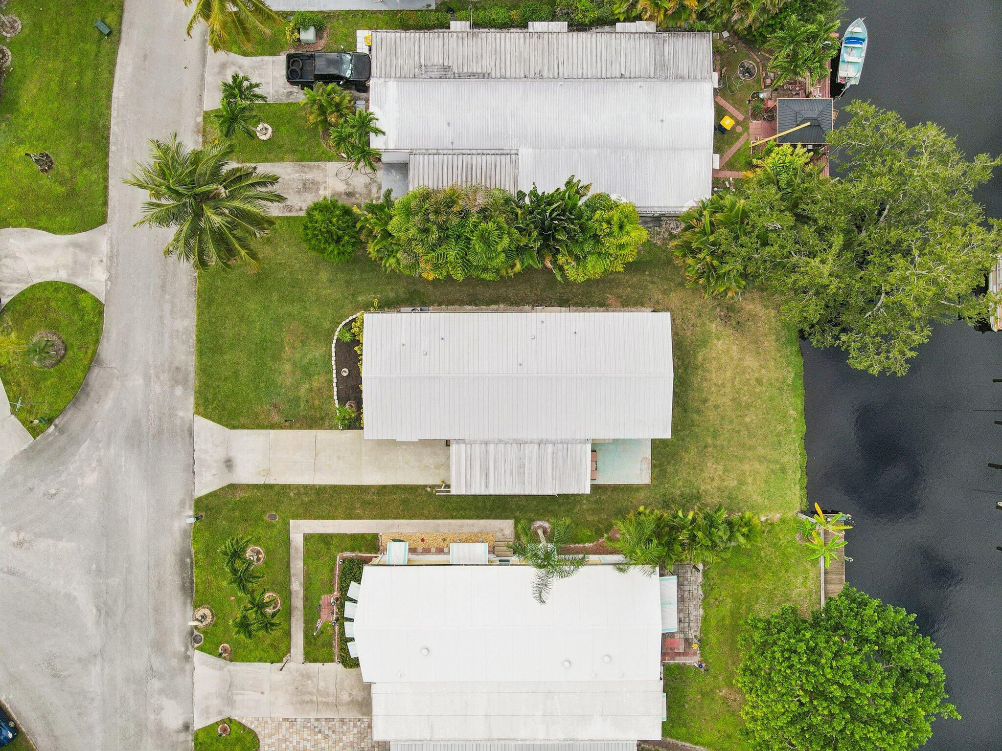 251 Southeast Paradise Place Stuart, FL 34997 - Photo 31 of 39 an aerial view of a house having yard
