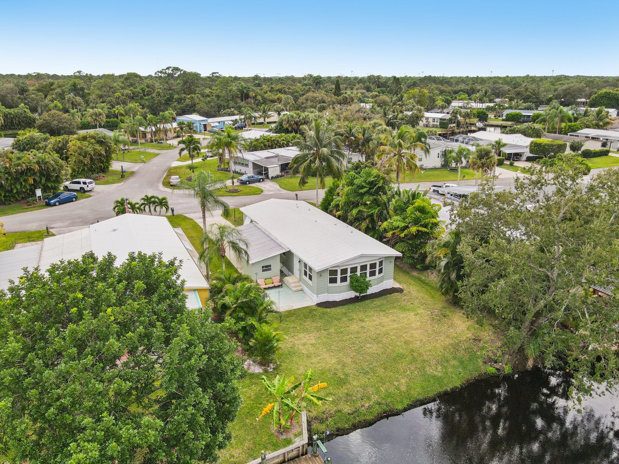 251 Southeast Paradise Place Stuart, FL 34997 - Photo 32 of 39 a view of a city with mountains in the background