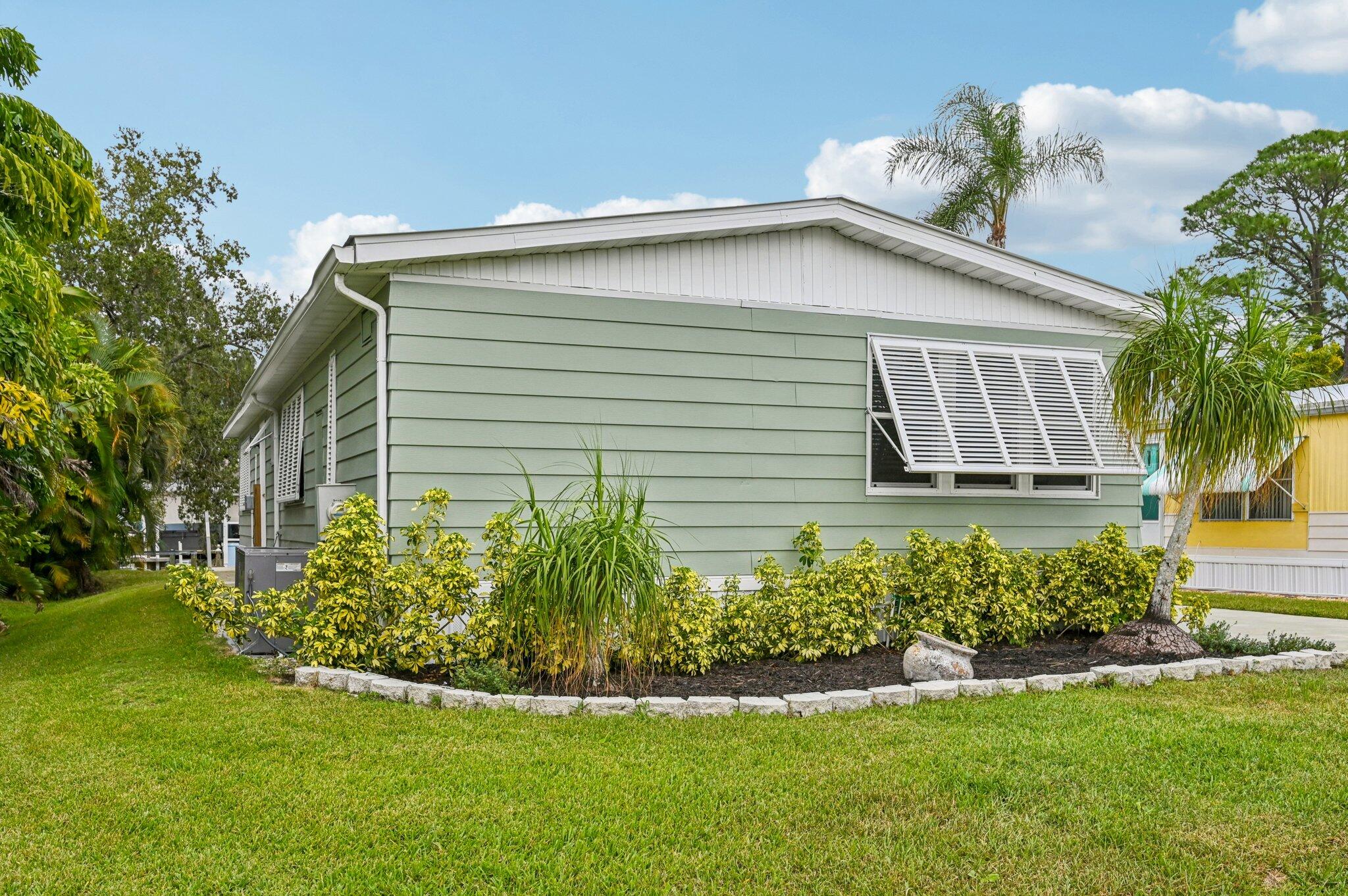 251 Southeast Paradise Place Stuart, FL 34997 - Photo 36 of 39 a house that has a lot of plants in it