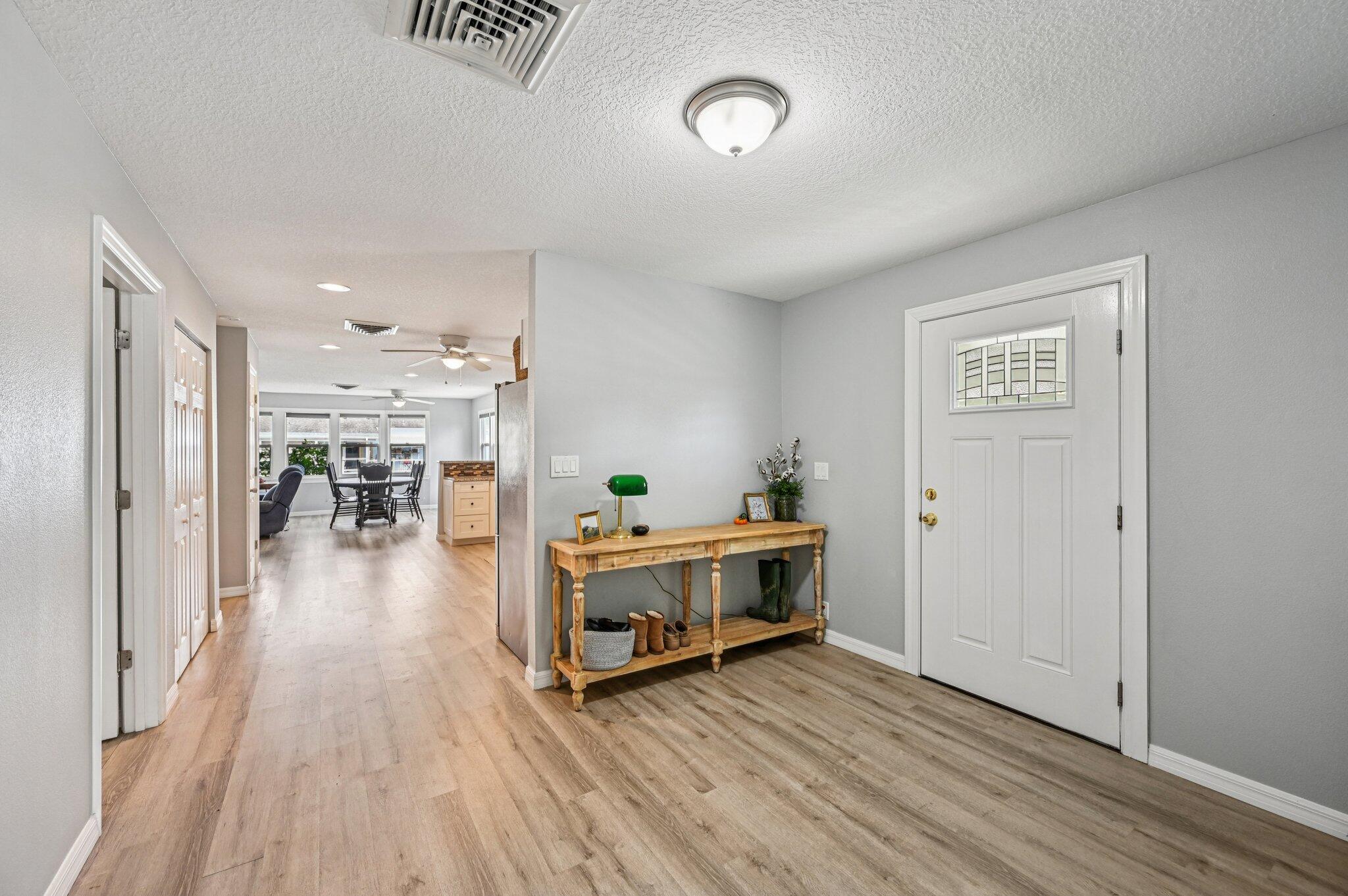 251 Southeast Paradise Place Stuart, FL 34997 - Photo 6 of 39 a view of a livingroom with furniture and hardwood floor