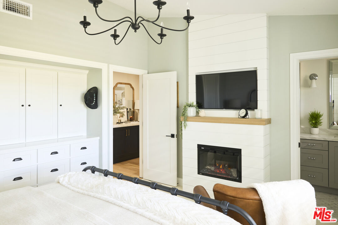 358 Via Metates Oceanside, CA 92057 - Photo 13 of 29 a bedroom with a bed and a flat screen tv