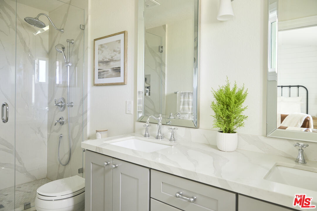358 Via Metates Oceanside, CA 92057 - Photo 14 of 29 a bathroom with a sink a toilet and shower