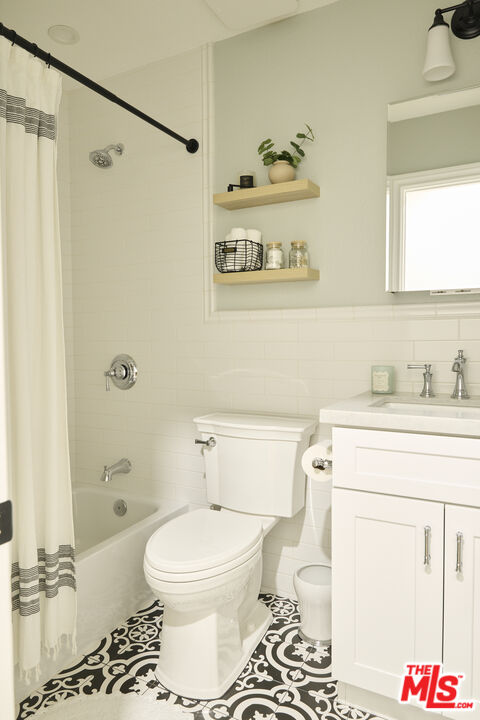 358 Via Metates Oceanside, CA 92057 - Photo 18 of 29 a bathroom with a toilet a sink and a shower