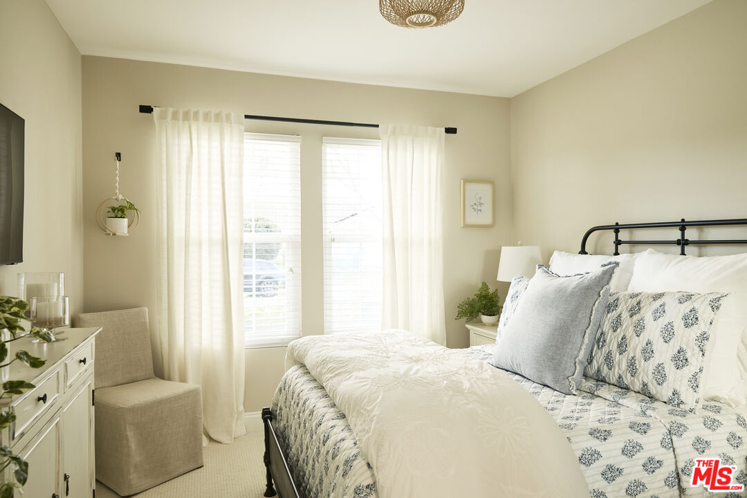 358 Via Metates Oceanside, CA 92057 - Photo 19 of 29 a bedroom with a bed and a couch