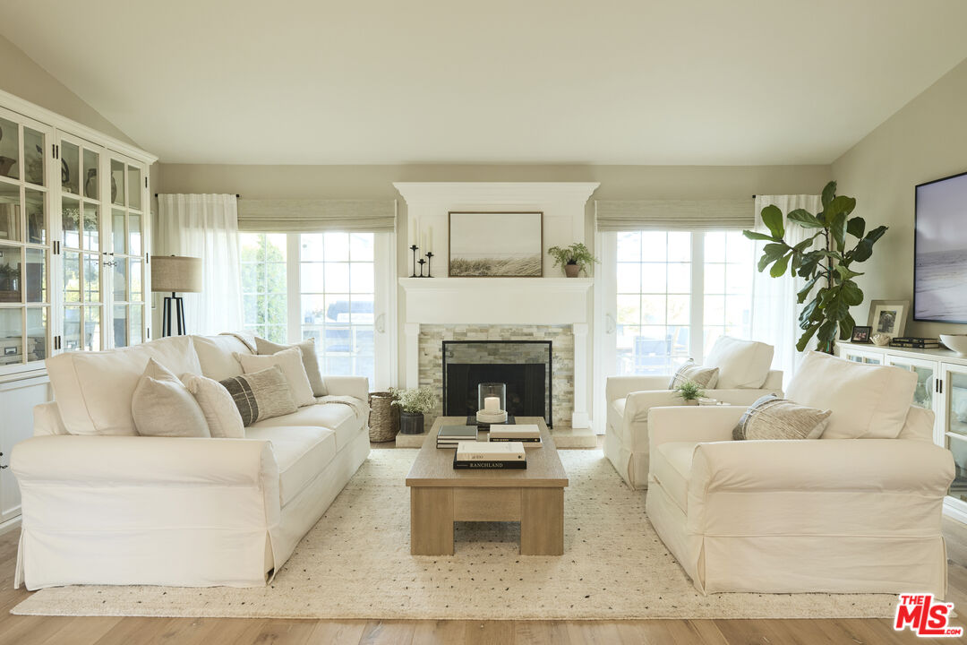 358 Via Metates Oceanside, CA 92057 - Photo 2 of 29 a living room with furniture and a fireplace