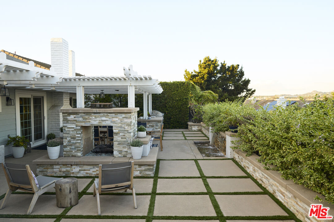 358 Via Metates Oceanside, CA 92057 - Photo 25 of 29 a view of a patio with table and chairs and potted plants