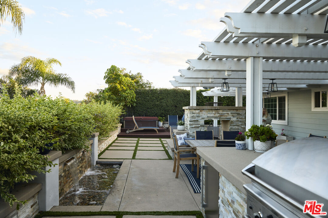 358 Via Metates Oceanside, CA 92057 - Photo 26 of 29 front view of a building with a garden