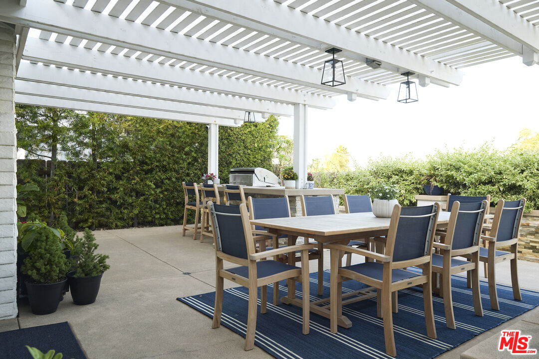 358 Via Metates Oceanside, CA 92057 - Photo 27 of 29 a view of a patio with a table chairs and a table