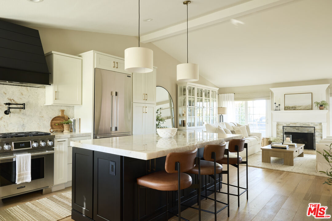 358 Via Metates Oceanside, CA 92057 - Photo 3 of 29 a large kitchen with lots of counter space a sink appliances and dining table