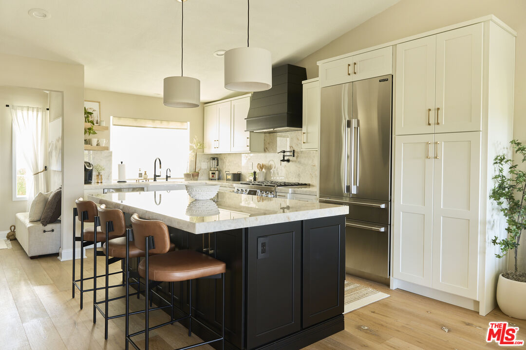 358 Via Metates Oceanside, CA 92057 - Photo 4 of 29 a kitchen with stainless steel appliances granite countertop a sink and a refrigerator