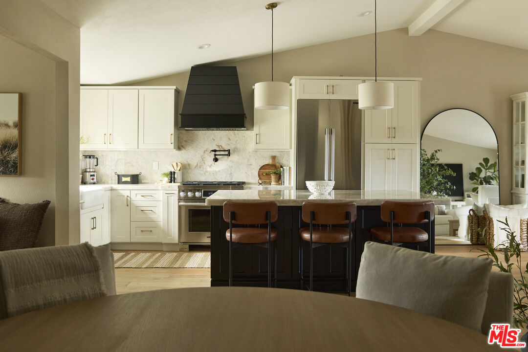 358 Via Metates Oceanside, CA 92057 - Photo 5 of 29 a kitchen with stainless steel appliances granite countertop a sink a stove and a refrigerator