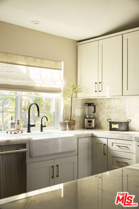 358 Via Metates Oceanside, CA 92057 - Photo 10 of 29 a kitchen with stainless steel appliances granite countertop a sink a stove and cabinets