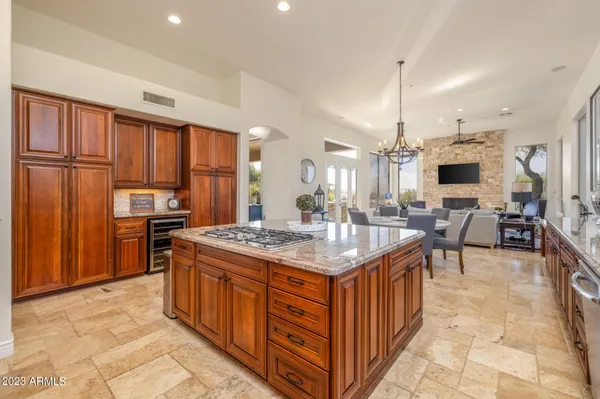 a kitchen with stainless steel appliances granite countertop a stove and a refrigerator