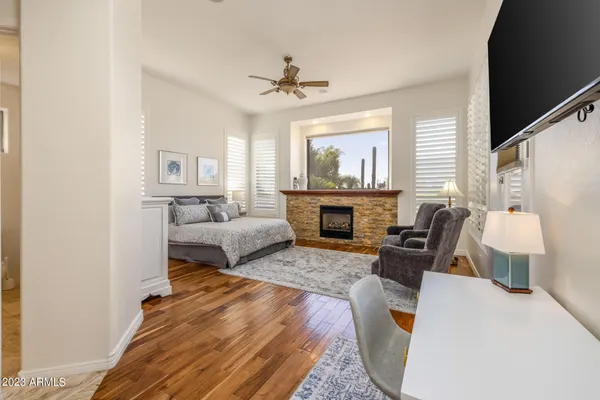a bathroom with a granite countertop tub sink and mirror