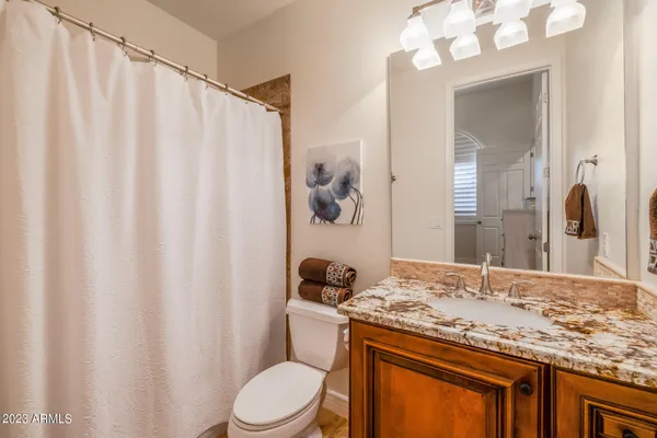 a view of bathroom with a sink a mirror and a shower