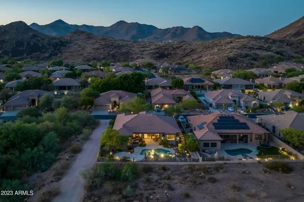 a view of a lake with boats and palm trees