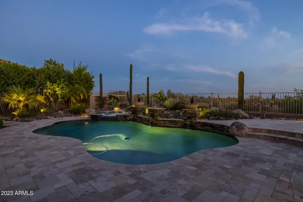 an aerial view of a house with garden space and trees