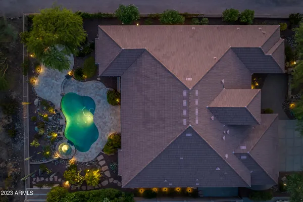 a view of a swimming pool with lounge chairs