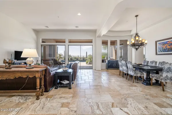 a view of a livingroom with furniture window and wooden floor