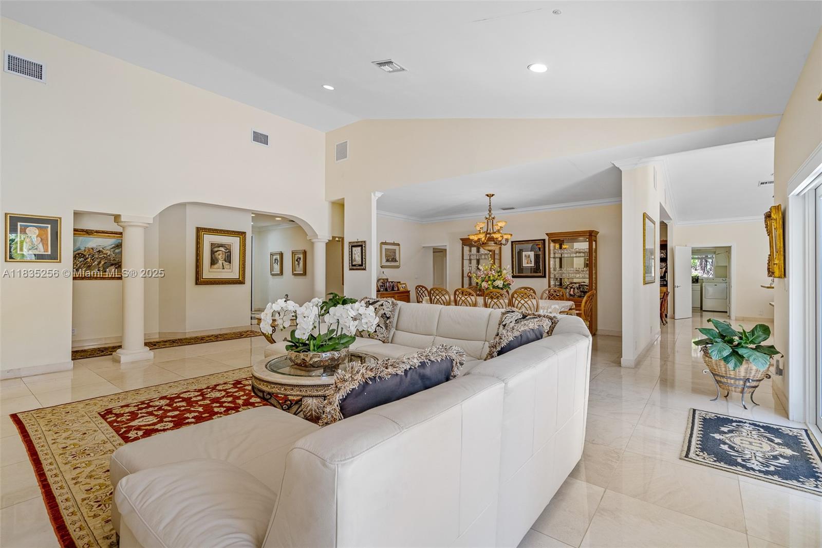 10735 Southwest 58th Avenue Pinecrest, FL 33156 - Photo 15 of 75 a living room with furniture and a table