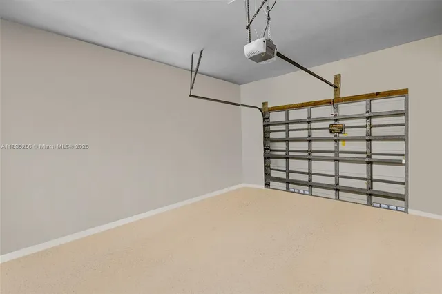 a living room with furniture a chandelier and a dining table