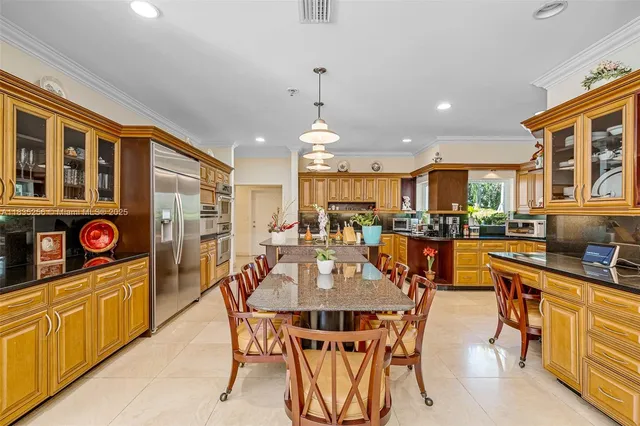 a kitchen with stainless steel appliances granite countertop a sink and cabinets