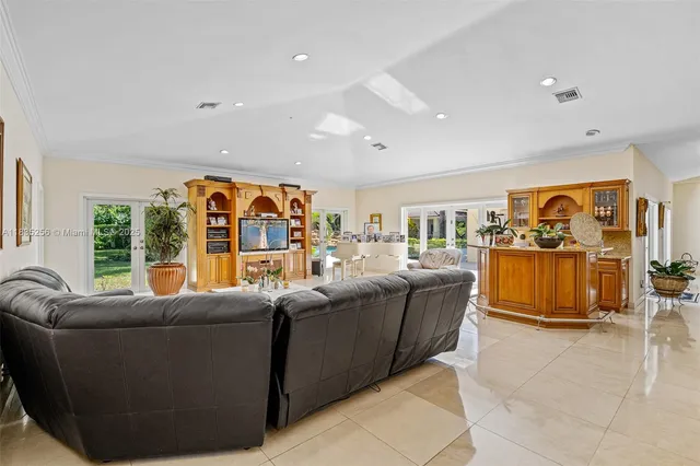 a white toilet sitting next to a white wall