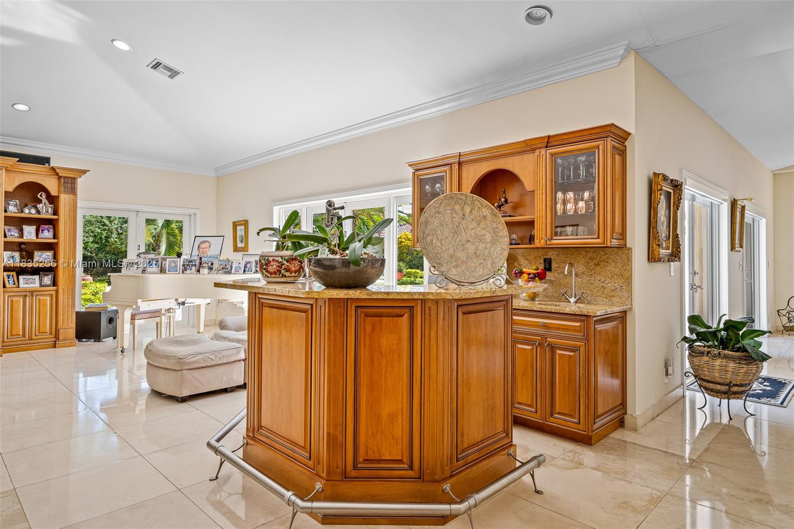 10735 Southwest 58th Avenue Pinecrest, FL 33156 - Photo 31 of 75 a living room with furniture a chandelier and a dining table