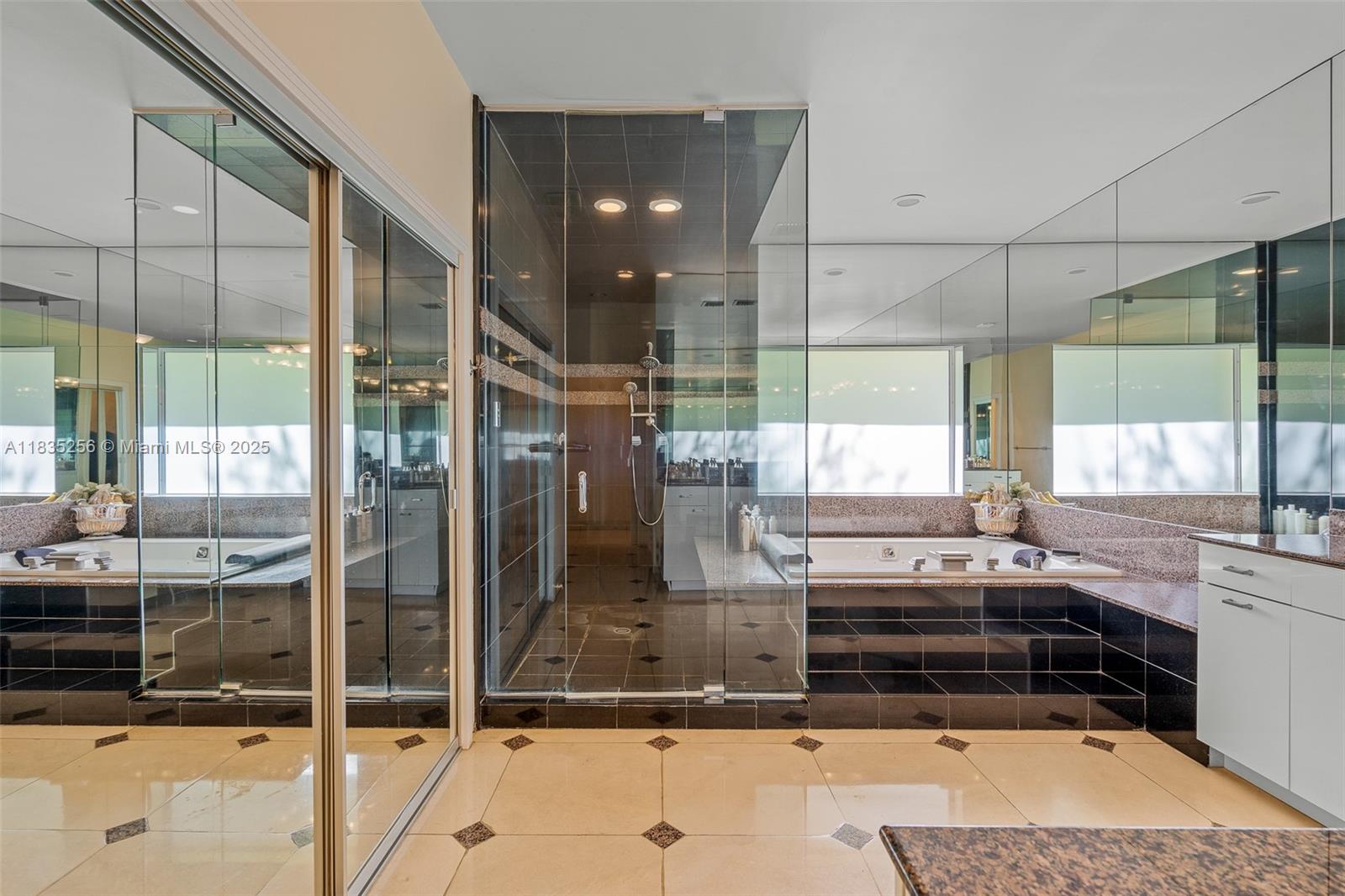 10735 Southwest 58th Avenue Pinecrest, FL 33156 - Photo 38 of 75 a kitchen with kitchen island granite countertop a sink and a counter top space