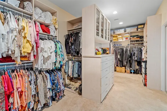 a view of a house with swimming pool and sitting area