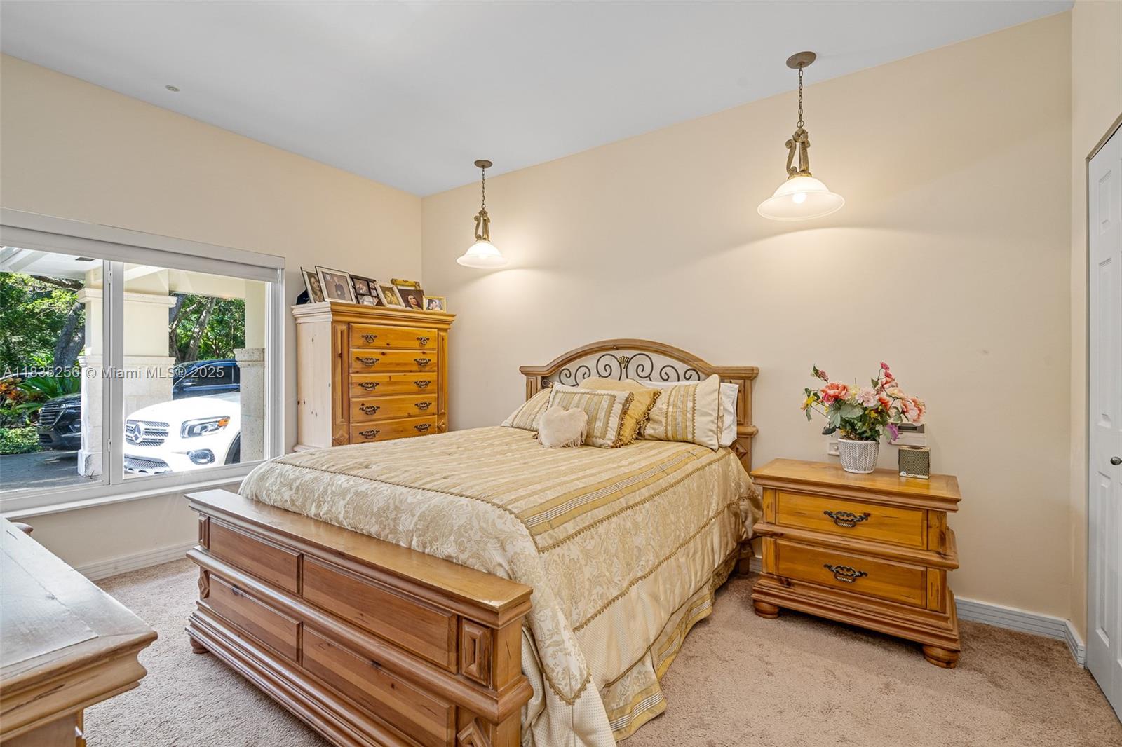 10735 Southwest 58th Avenue Pinecrest, FL 33156 - Photo 47 of 75 a bedroom with a bed and a window