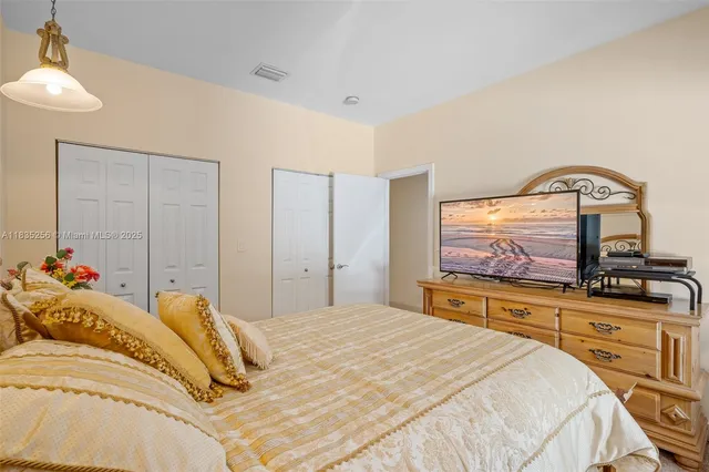 a view of a house with swimming pool and a garden