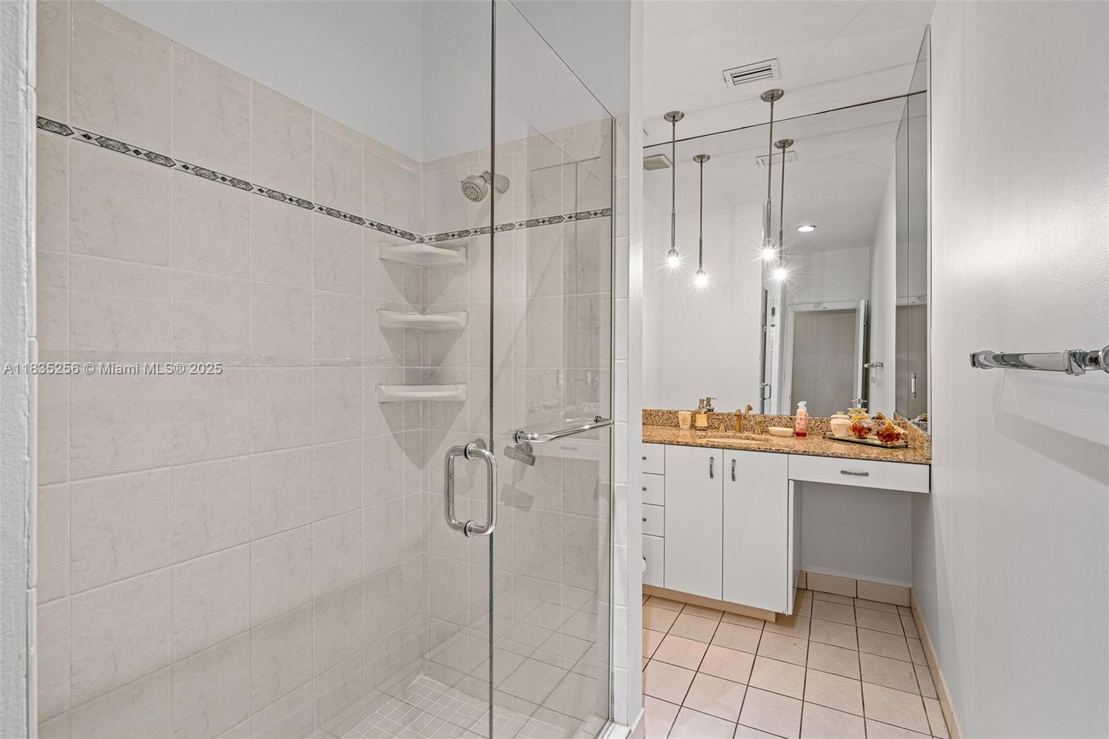 10735 Southwest 58th Avenue Pinecrest, FL 33156 - Photo 49 of 75 a bathroom with a shower and a sink